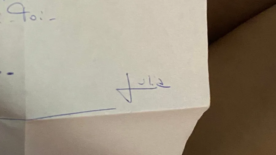 Scrap of paper: 'Toi -' and a signature, almost nothing written