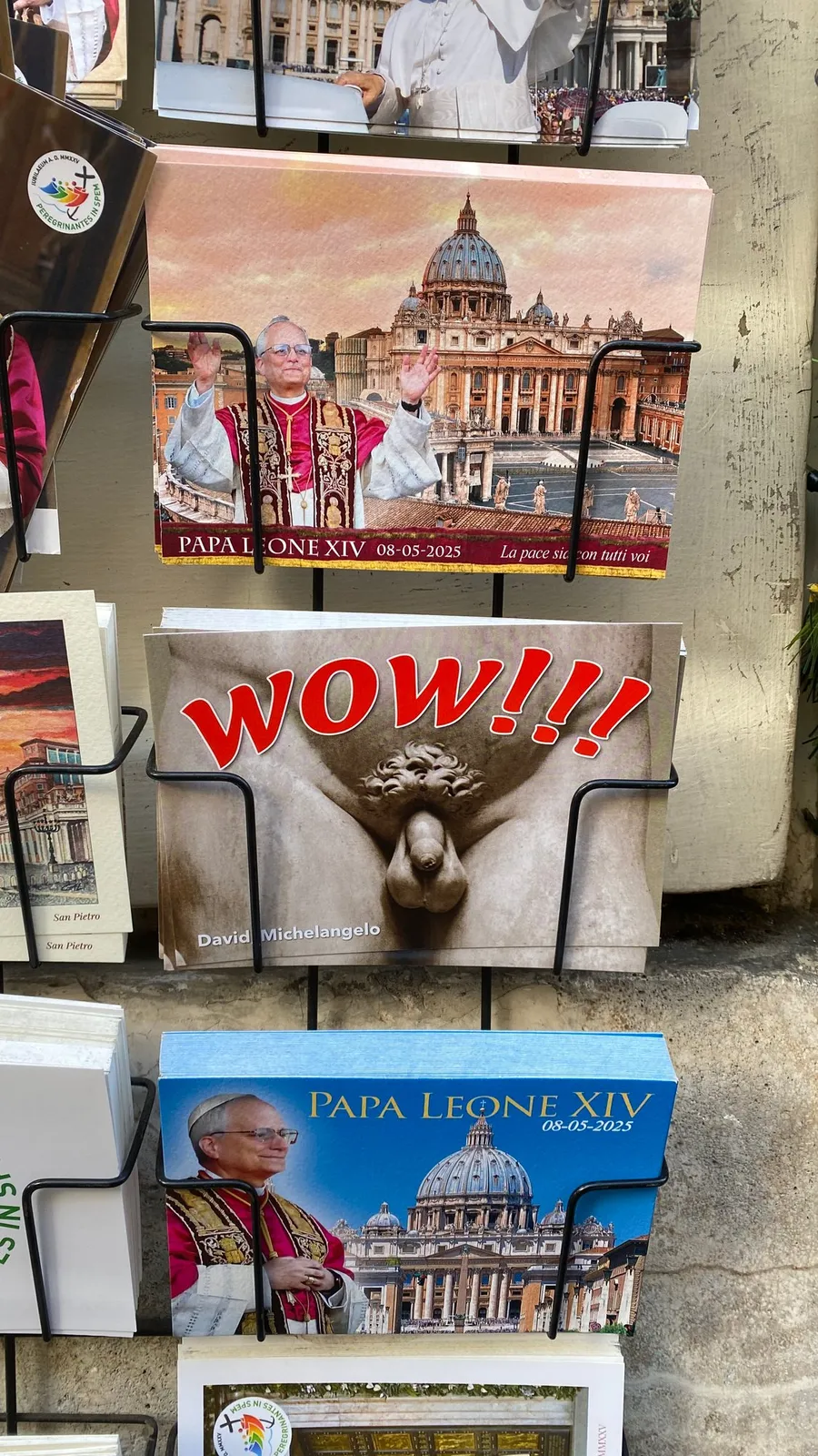 Postcard rack: popes, St Peter's and a cheeky 'WOW!!!' card