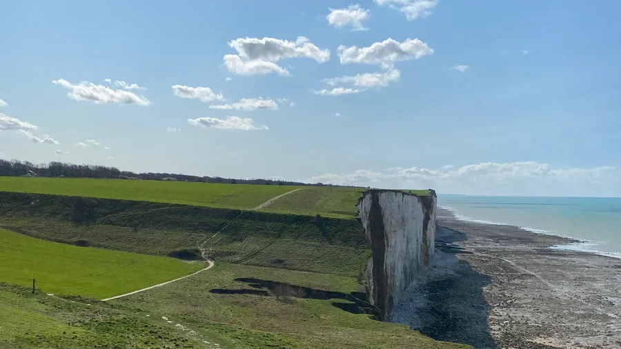 White chalk cliffs dropping to the sea at Ault, bright spring day