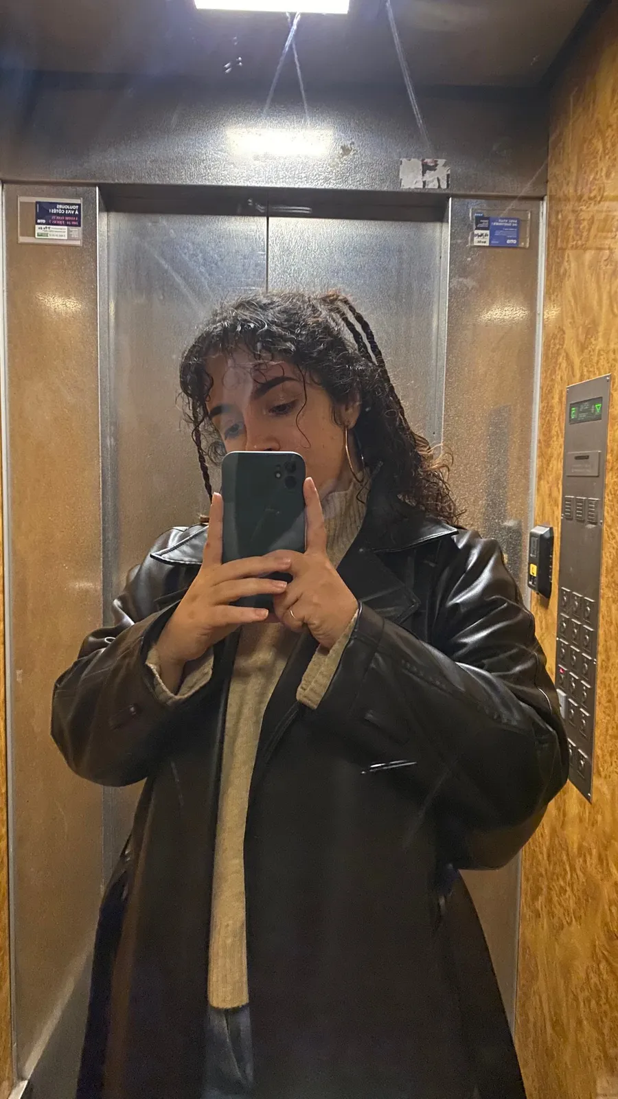 Lift mirror selfie, long leather coat