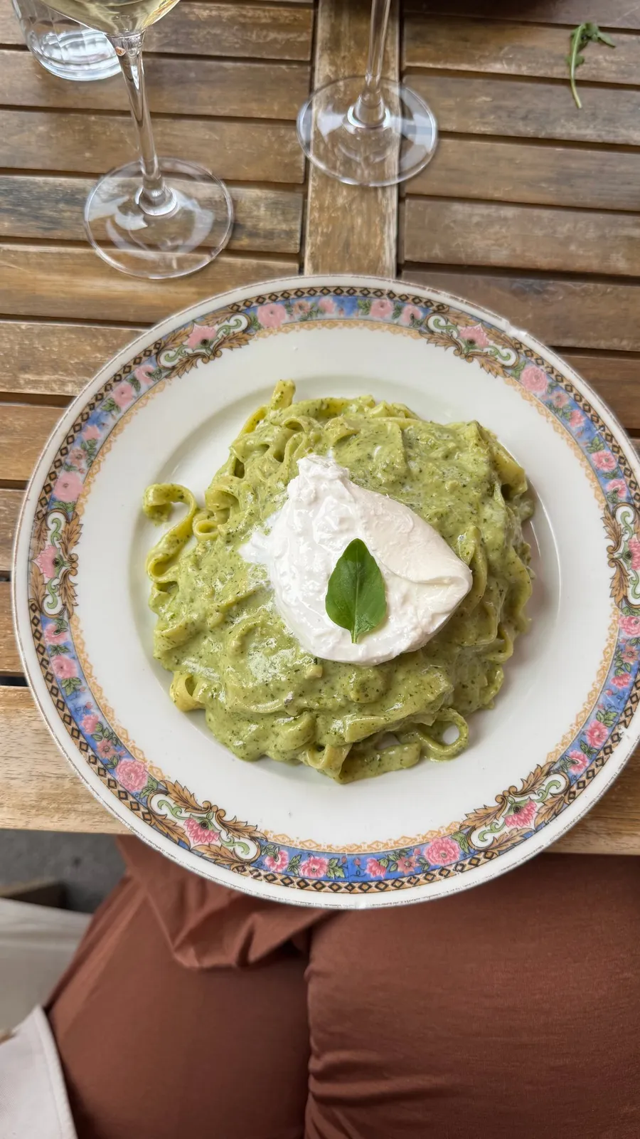Pistachio-green pasta on a flowery vintage plate