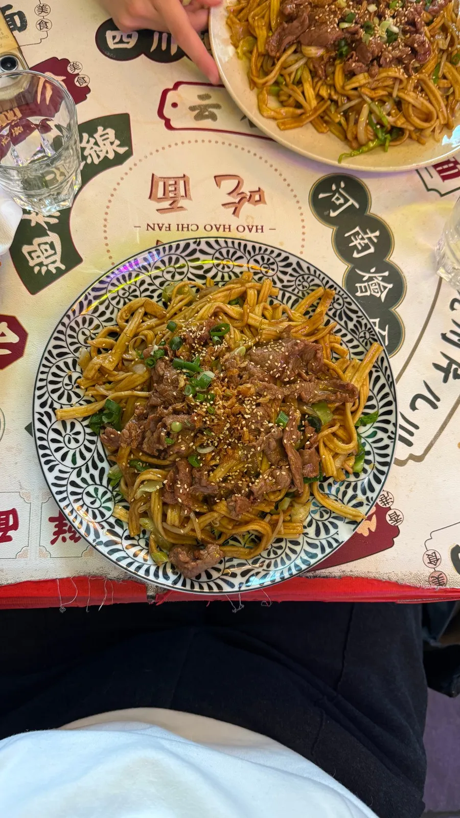 Noodles on a newspaper-print placemat
