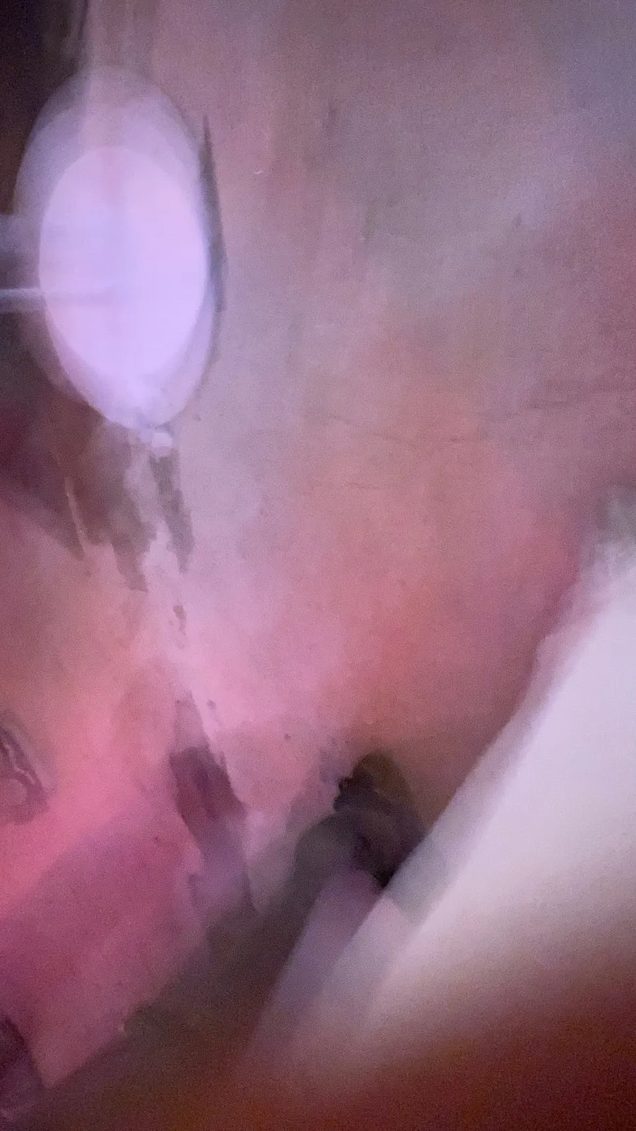 Pink fleshy blur, a glowing white oval: pocket shot at 4am