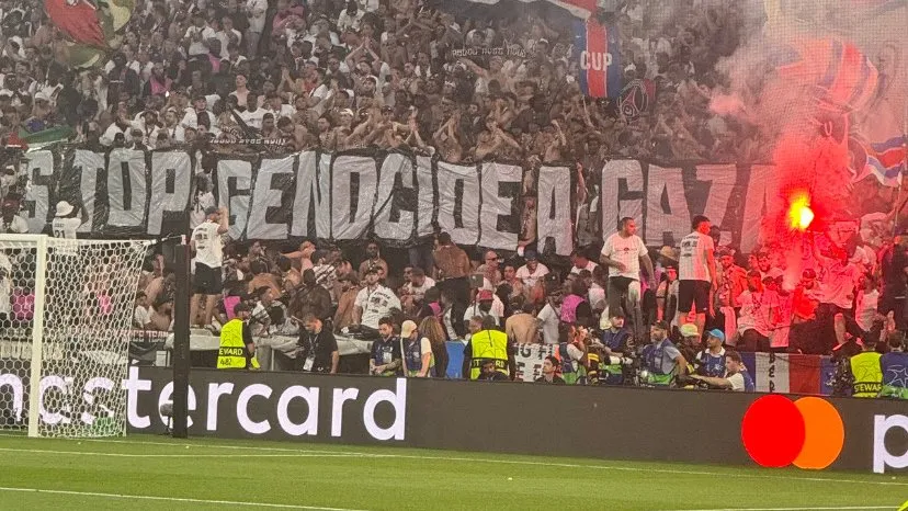 Stadium tifo 'Stop genocide à Gaza', red flare, Mastercard board