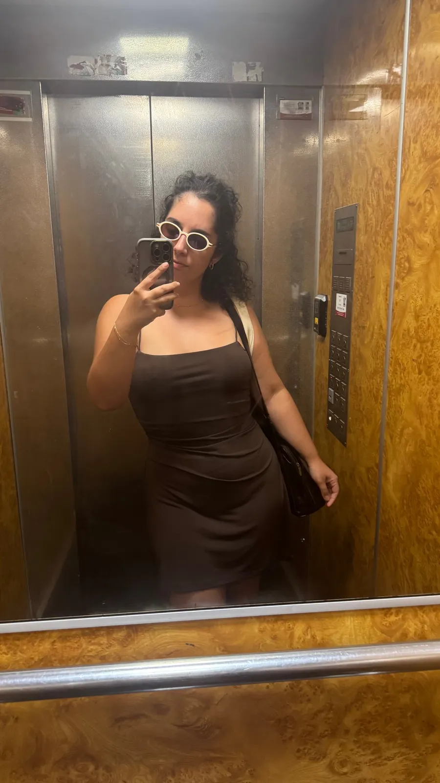 Lift mirror selfie, black dress and white sunglasses