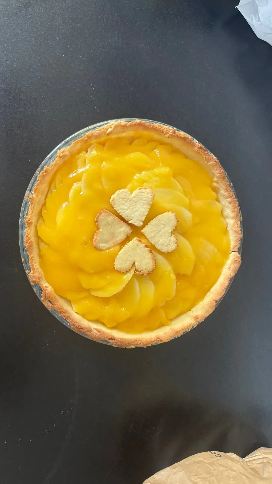Lemony fruit tart with little pastry hearts in the middle