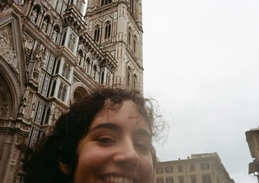 Big smiling selfie at the foot of the Duomo