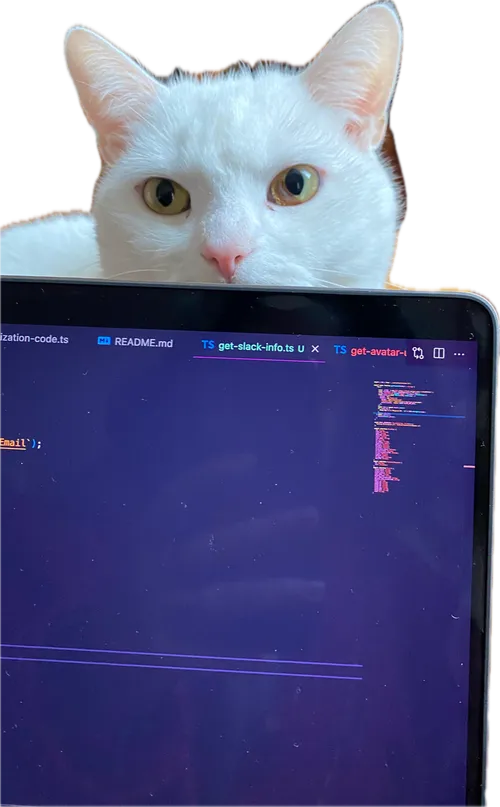 A white cat peeking over a laptop full of code