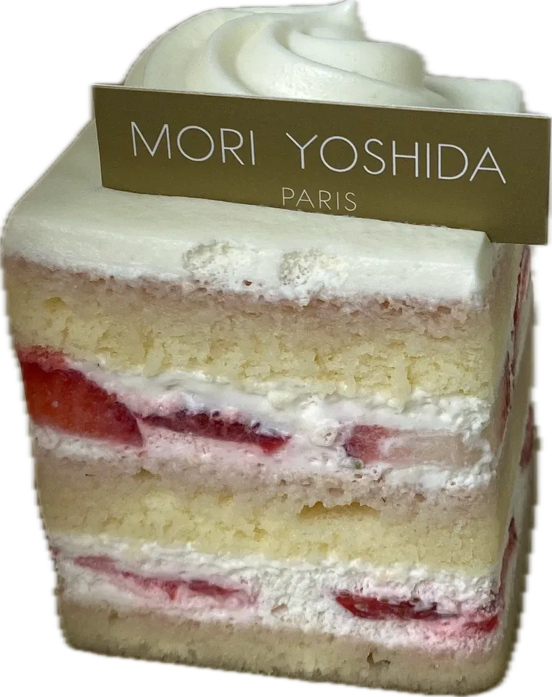 Slice of strawberry shortcake with a Mori Yoshida tag