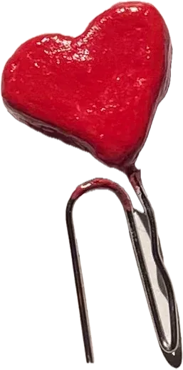 Red clay heart on a paperclip